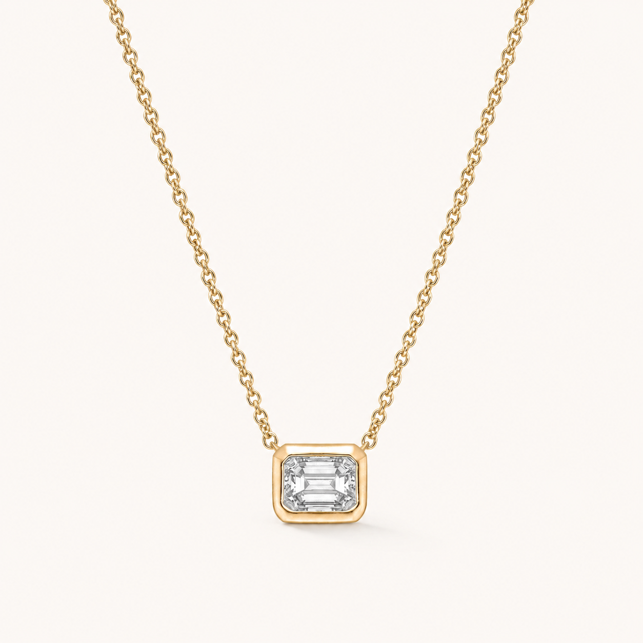 East-West Emerald Bezel Solitaire Diamond Necklace in Yellow Gold