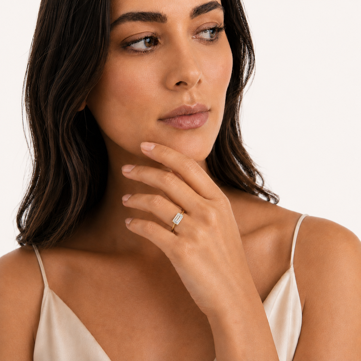 East-West Emerald Solitaire Diamond Ring