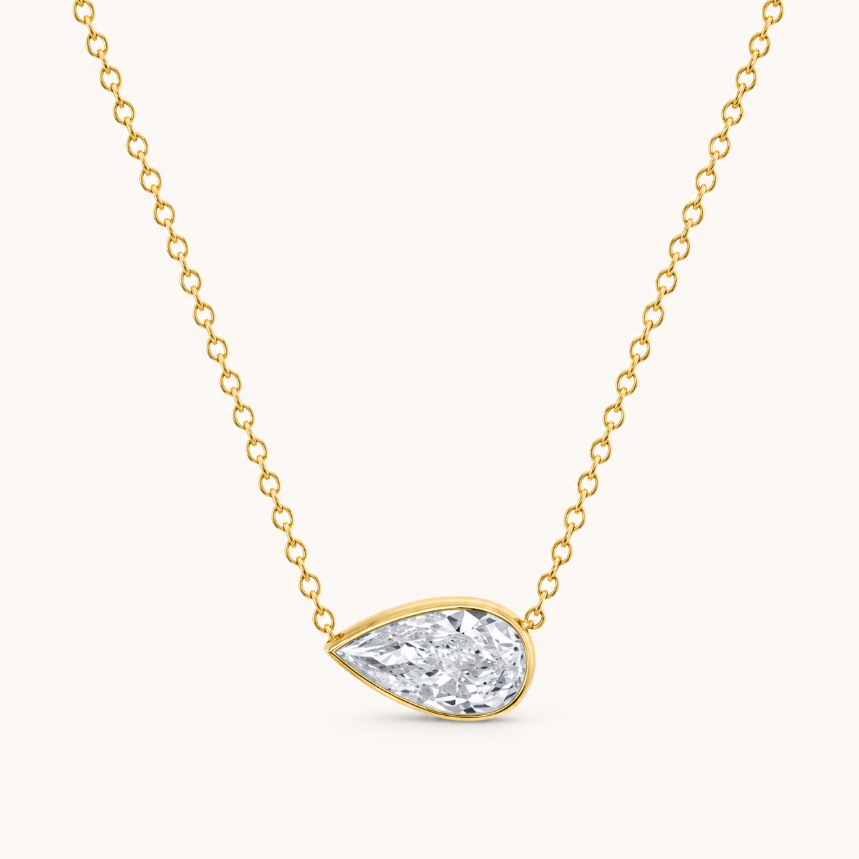 East-West Pear Bezel Solitaire Diamond Necklace in Yellow Gold