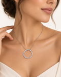Close-up of The Infinity Diamond Necklace worn on model